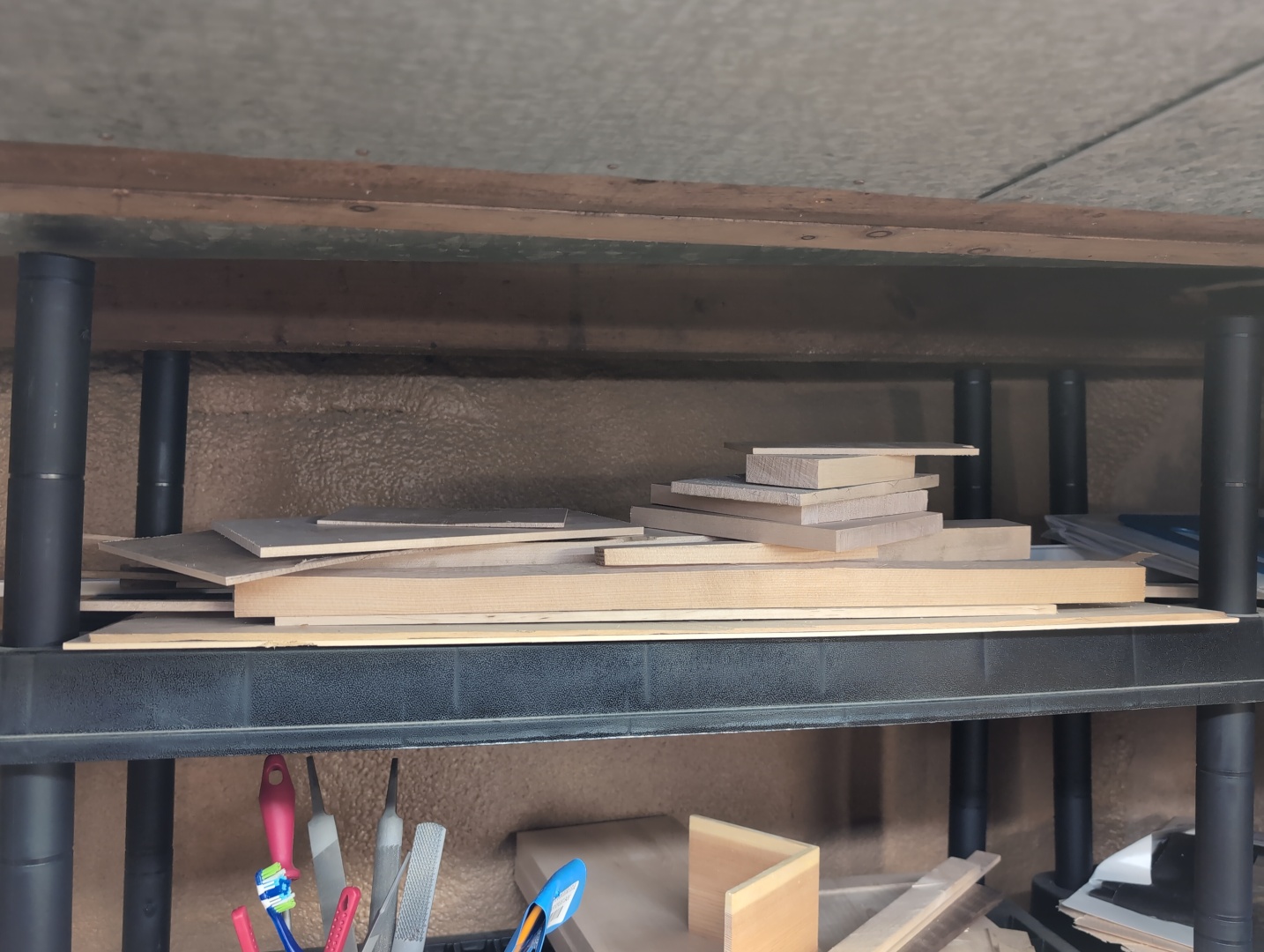Shelves with some wood offcuts and woodworking tools
