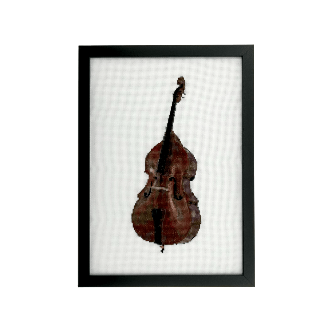 double bass hand stitched on white aida fabric in a black frame