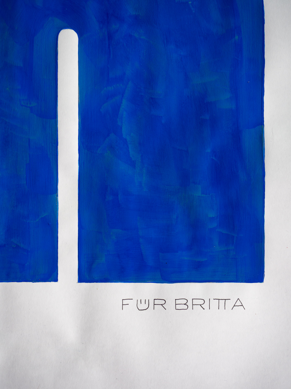 Written dedication "für Britta" underneath the blue shape.