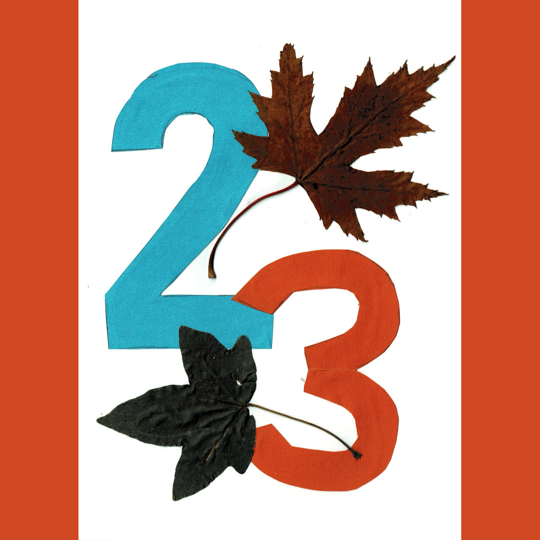 a collage of leaves and paper, depicting the number 23