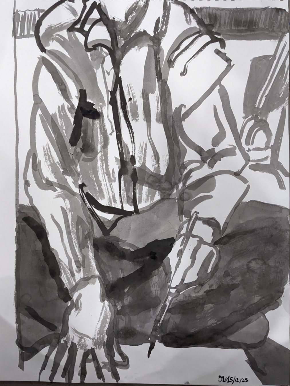 an ink drawing of a person from the neck down. they're sitting down crosslegged with one hand on the paper on the floor, and one hand poised with a brush in it.