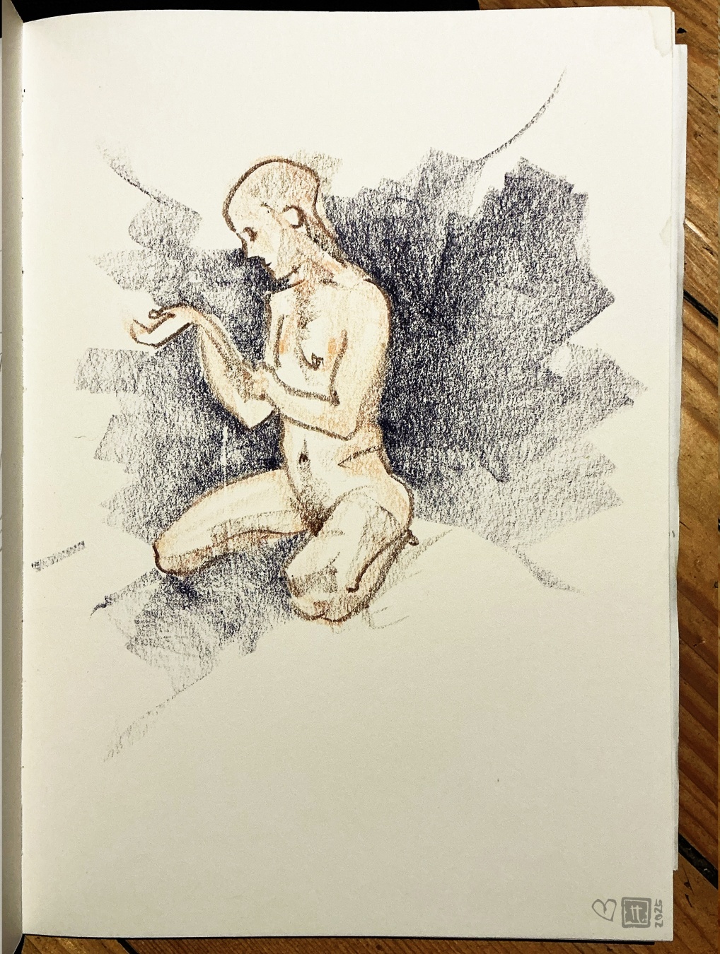 l. hockt uîn der mitte und hlt sich den arm